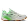 A pair of Yonex Performance 670 badminton shoes with white and green color scheme, designed for court play.