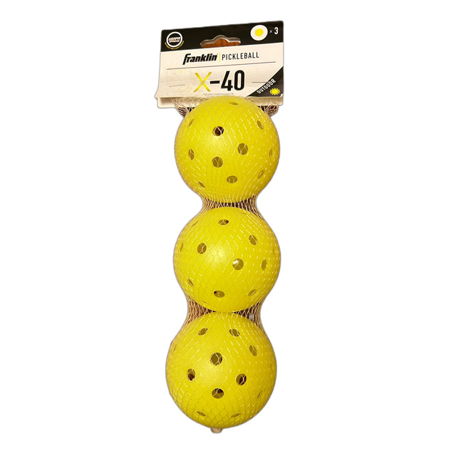 Three yellow pickleballs with a Franklin Sports packaging label on a white background