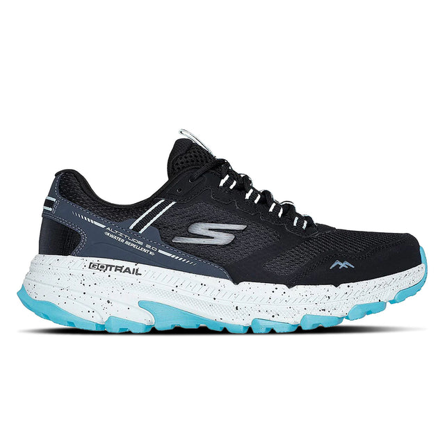 Black and blue running shoe with speckled sole on a white background