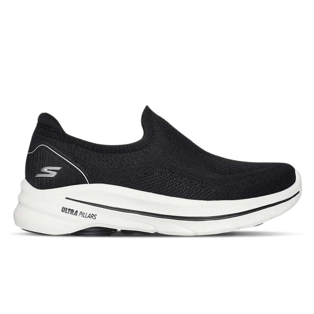 Black slip-on sneaker with white sole on a white background
