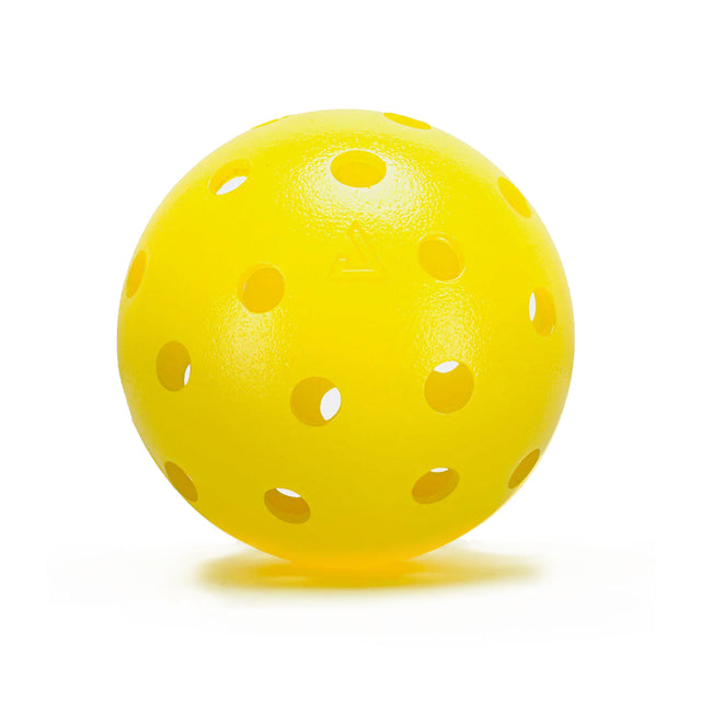 Yellow perforated ball on a white background