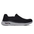 Black slip-on sneaker with a white background