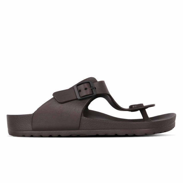 A brown slipper with a thong strap and a buckle.