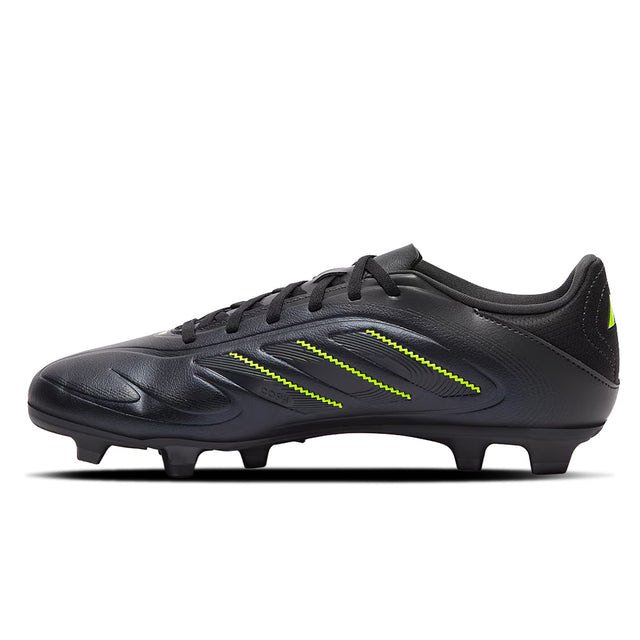 Black soccer cleat with green accents on a white background