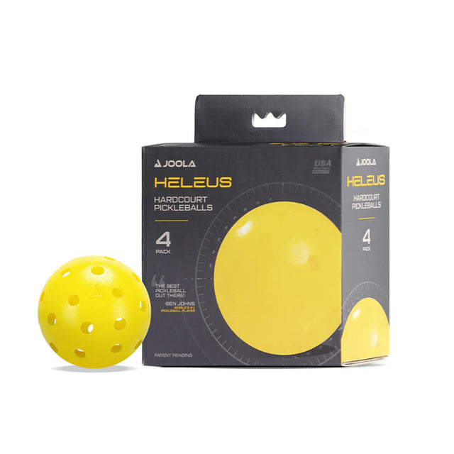 Yellow pickleball next to its packaging on a white background