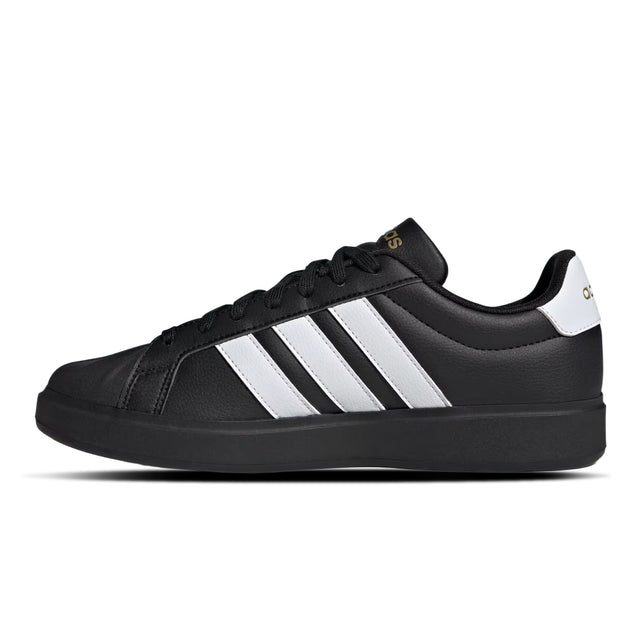 Black Adidas sneaker with white stripes on a white background