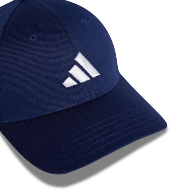 Navy blue cap with a white logo on a white background