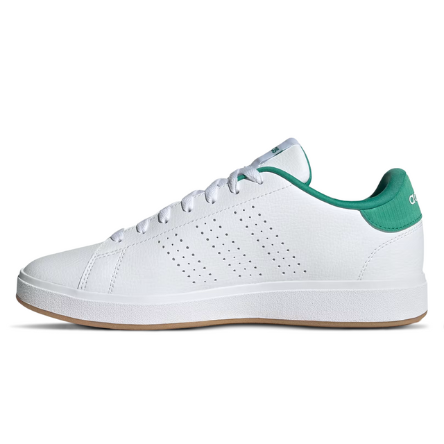 White sneaker with green accents on a white background