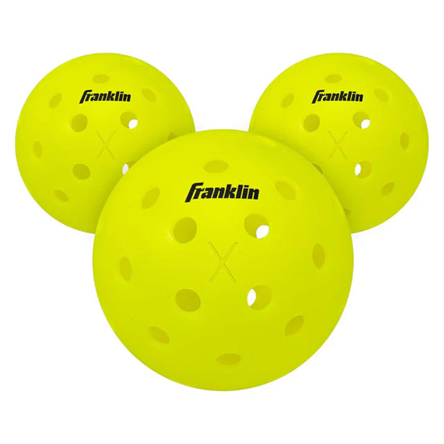 Three yellow pickleballs with Franklin branding on a white background