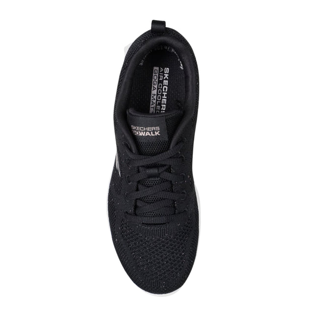 Black sneaker with visible brand logo on a white background
