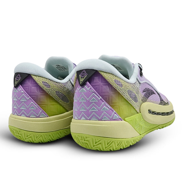 Pair of green and purple sneakers on a white background