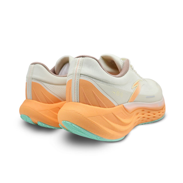 Pair of white and orange shoes on a white background