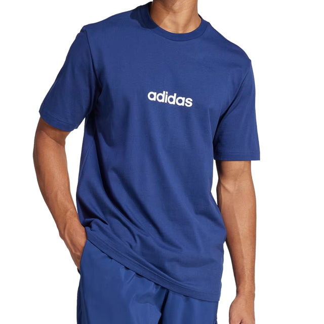 Person wearing a blue Adidas t-shirt on a white background