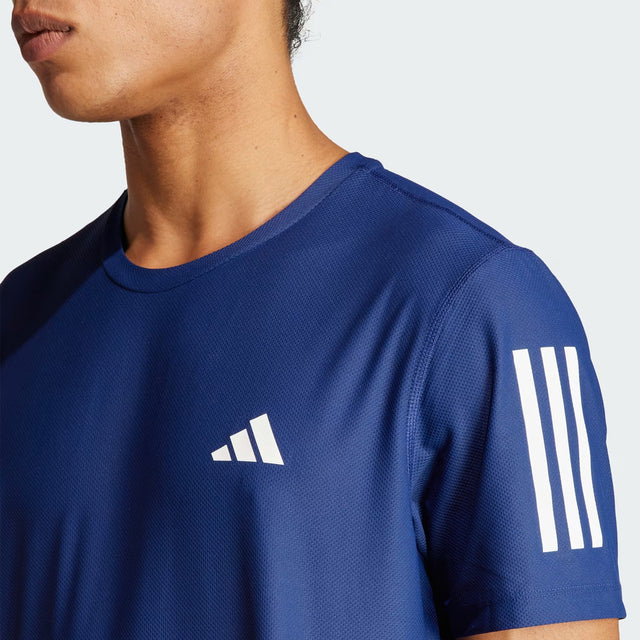Blue Adidas sports shirt with logo and stripes on a white background