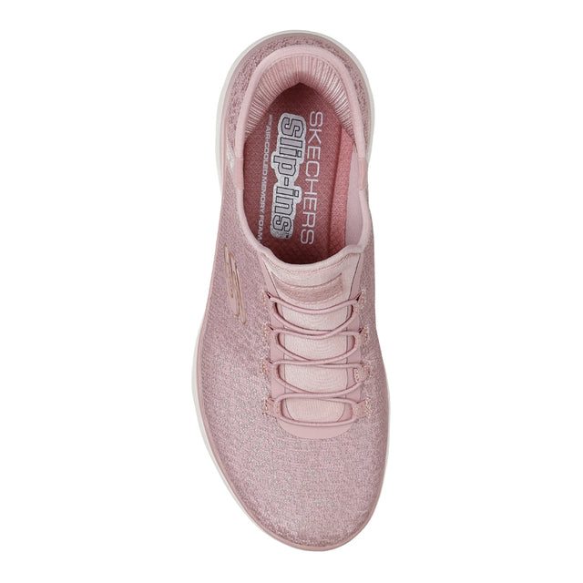Pink sneaker with 'Skechers' branding on a white background