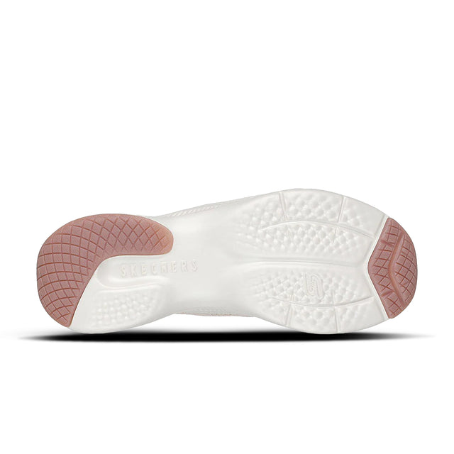 White shoe sole with pink heel cup on a white background
