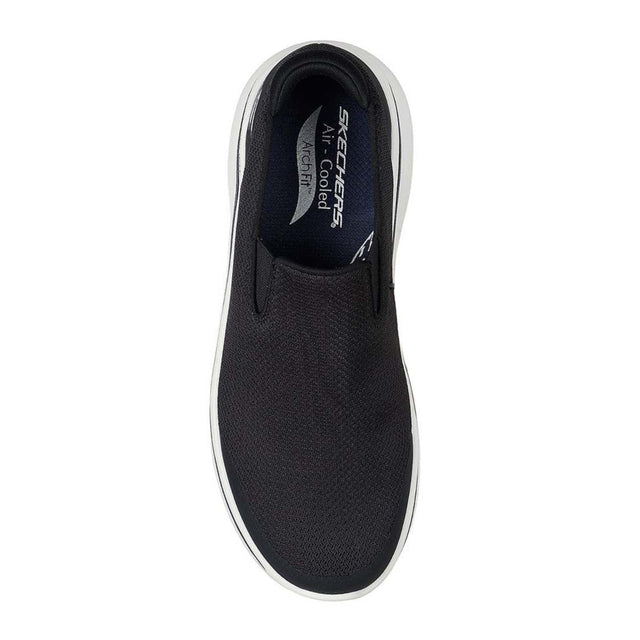 Black slip-on sneaker with 'Skechers' branding on a white background