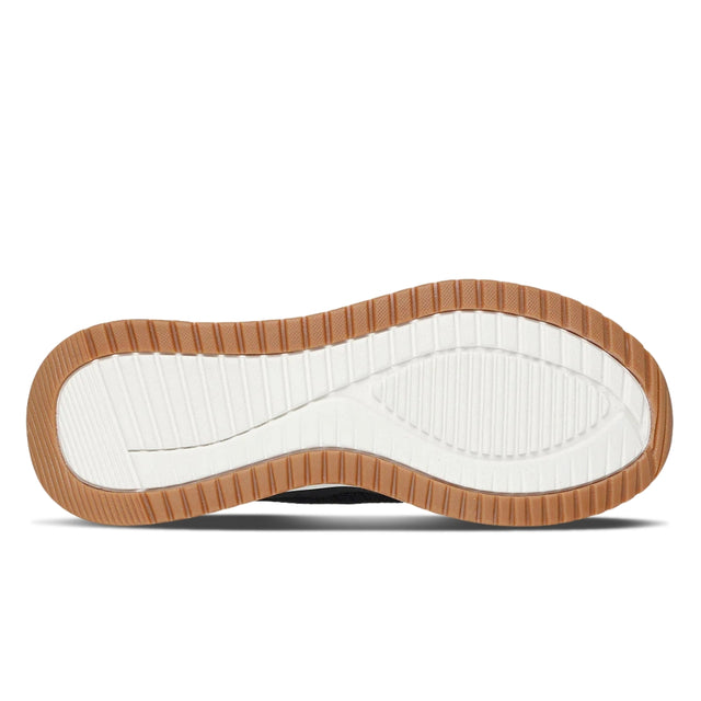 Close-up of a shoe sole with brown border and white center on a white background
