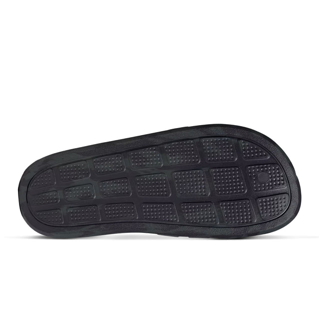 A pair of black adidas Adilette Flow slides outsole.