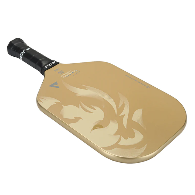 Gold pickleball paddle with black handle on a white background