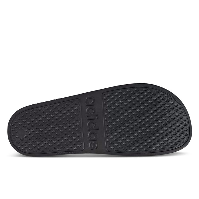 A pair of black adidas Adilette Aqua slippers with a streamlined silhouette and a molded EVA footbed - Outsole
