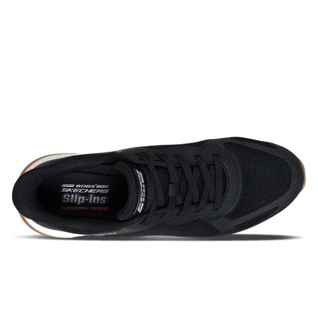 Black sneaker with visible brand logo on a white background
