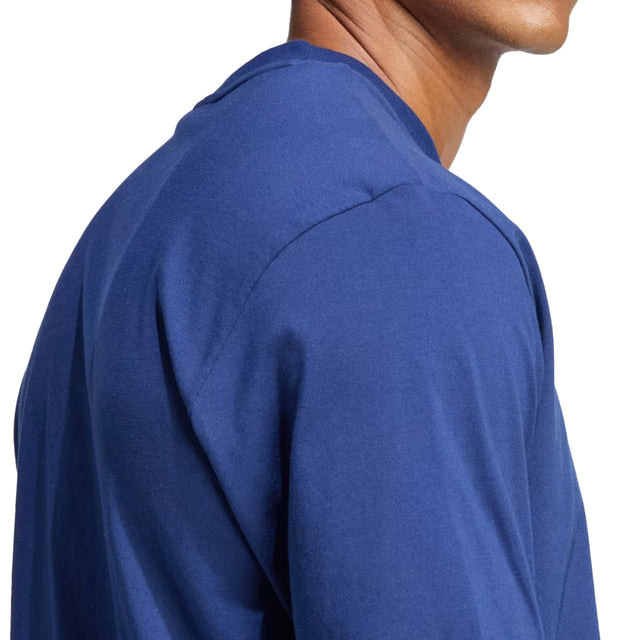 Close-up of a person wearing a blue long-sleeve shirt on a white background