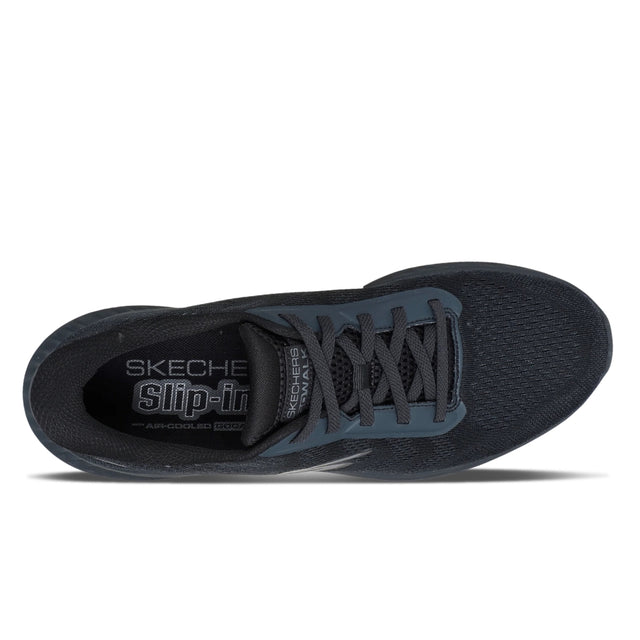 Black sneaker with 'Skechers' branding on a white background