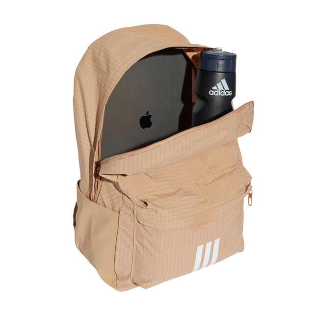Beige backpack with a laptop and water bottle on a white background