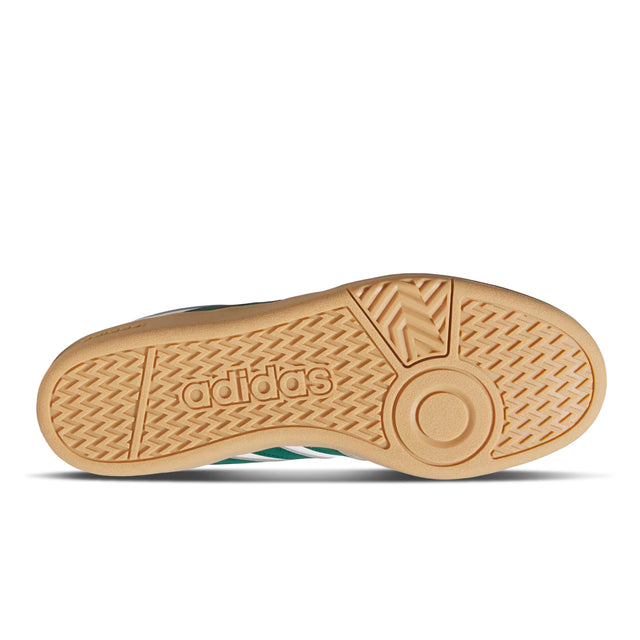 Close-up of Adidas shoe sole with brand logo on a white background