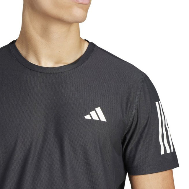 Black Adidas t-shirt with logo and stripes on a white background
