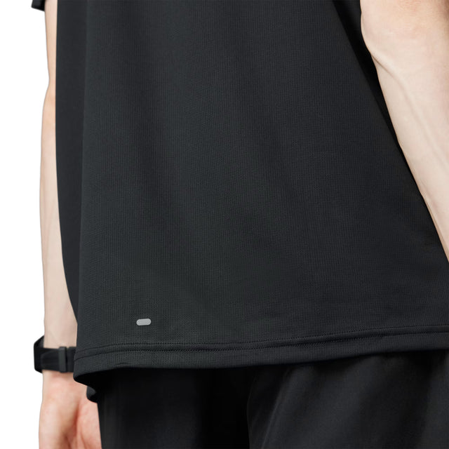 Close-up of a black sleeveless top with a brand logo on a white background