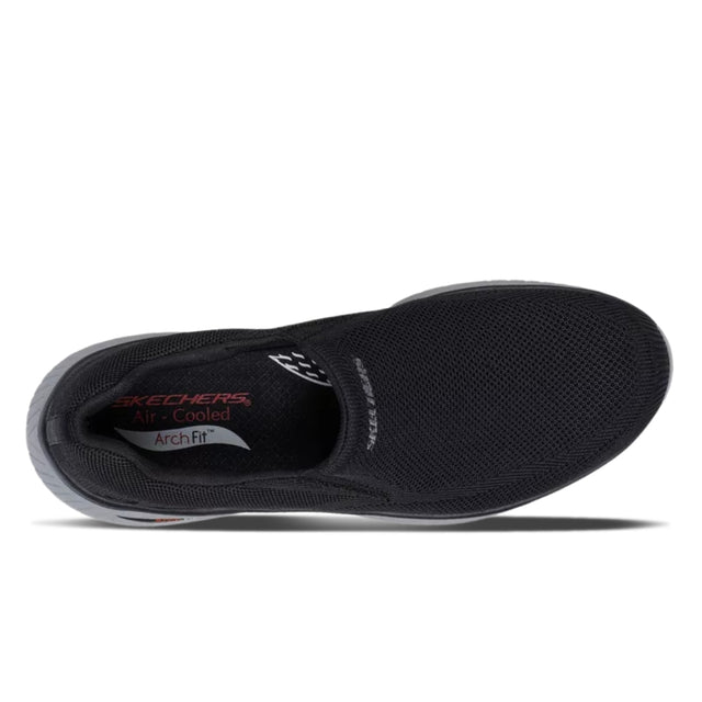 Black slip-on shoe with 'Skechers' branding on a white background