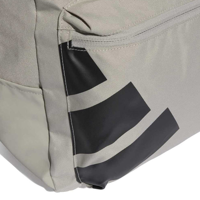 Close-up of a gray bag with black stripes on a white background