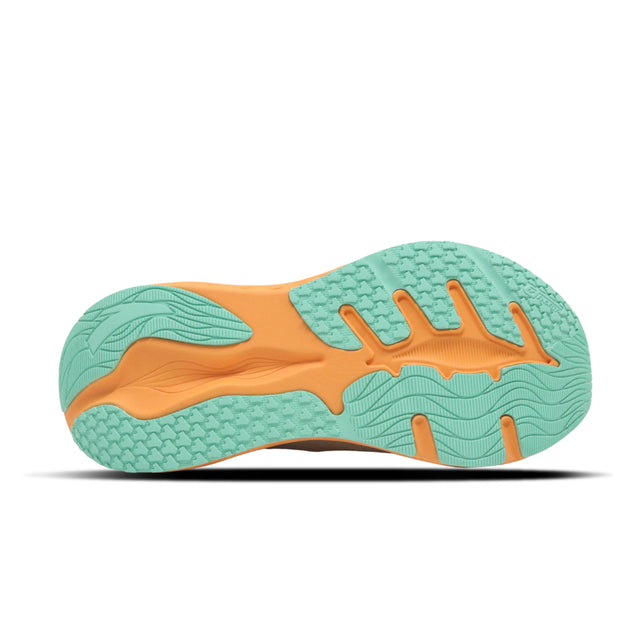 Close-up of a shoe sole with green and orange pattern on a white background