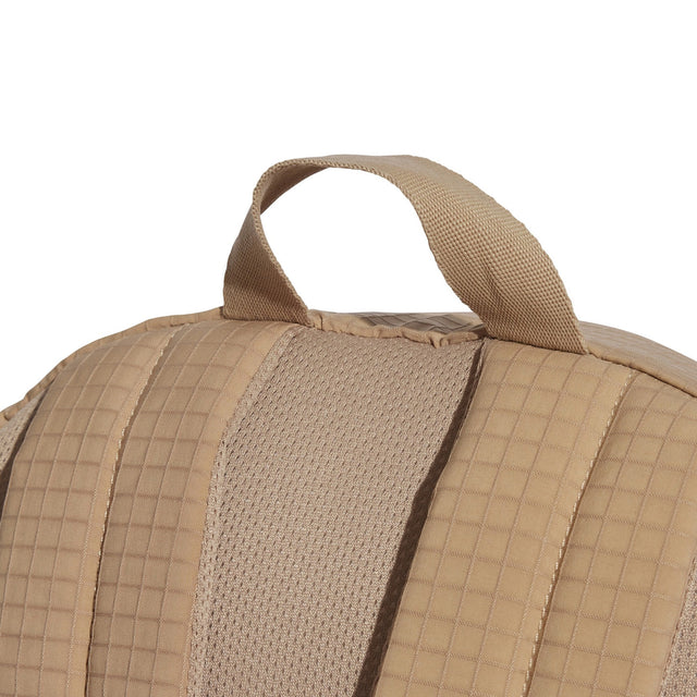 Close-up of a tan backpack with a handle on a white background