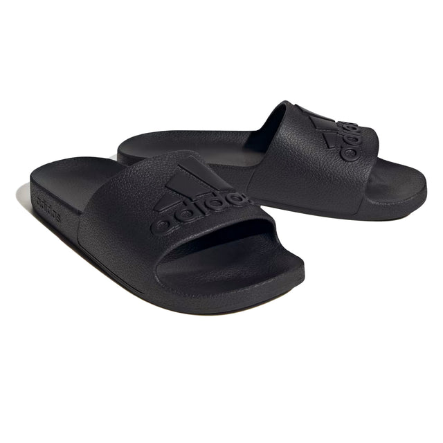 A pair of black adidas Adilette Aqua slippers with a streamlined silhouette and a molded EVA footbed.