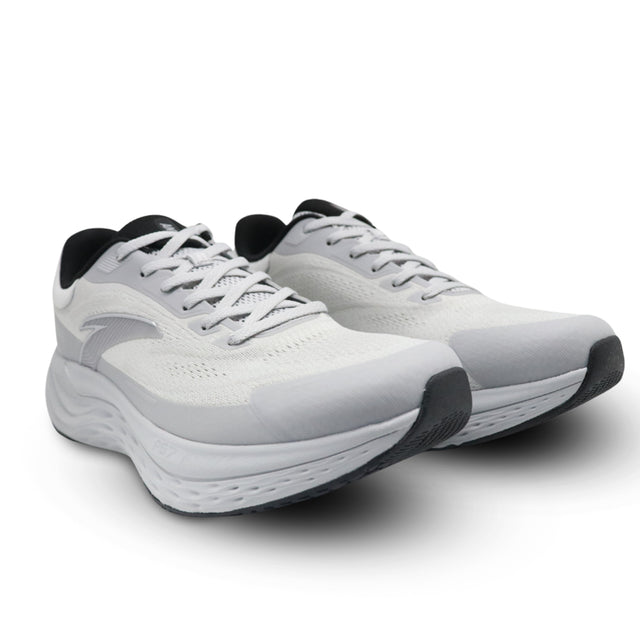 Pair of white running shoes with black accents on a white background