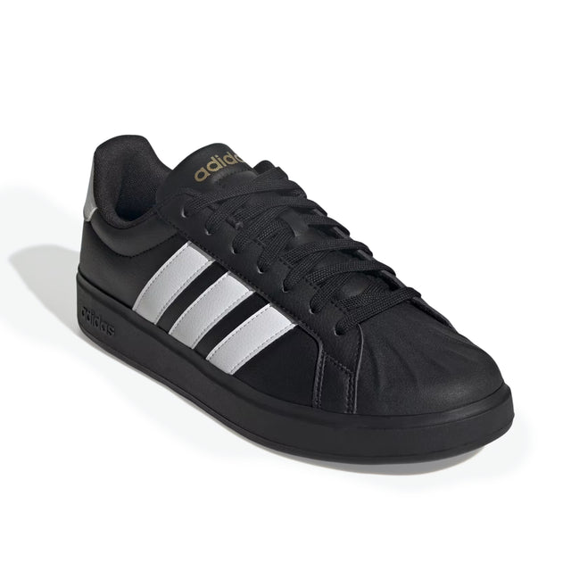 Black Adidas sneaker with white stripes on a white background