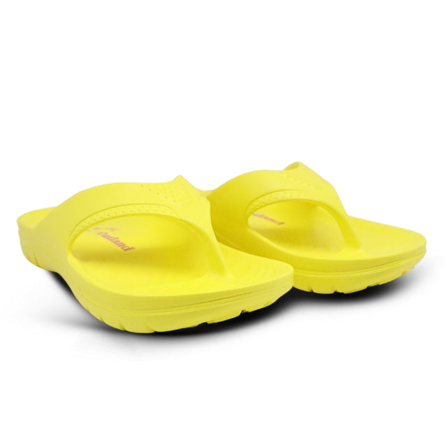 Pair of yellow sandals on a white background