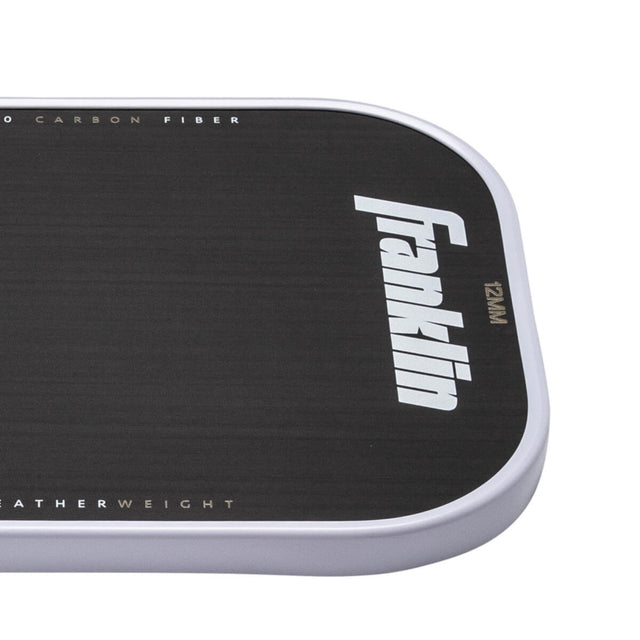 Close-up of a black and white Franklin product with branding on a white background