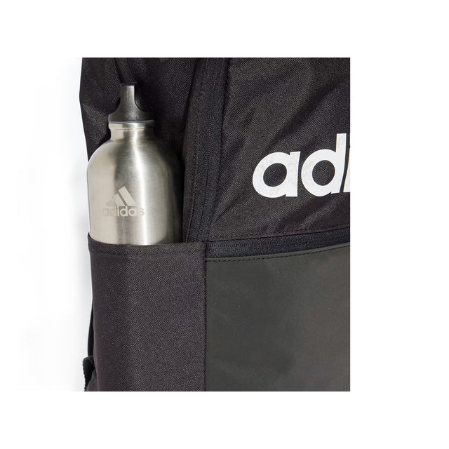 Black Adidas jacket with a silver water bottle in the pocket
