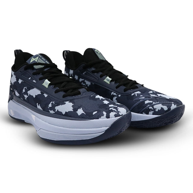 Pair of navy blue and white patterned sneakers on a white background