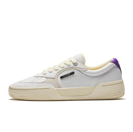 A pair of white and purple casual shoes with low-top design, featuring a lace-up closure and court-style sole.