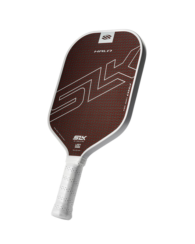 Pickleball paddle with brown and white design on a white background