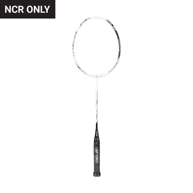 Unstrung Yonex badminton racket with a black grip and a silver frame.