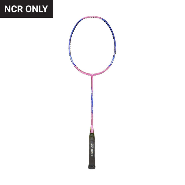 Unstrung Yonex badminton racket with a blue and pink frame, and a black grip.