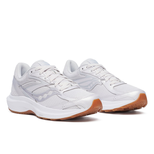 A pair of Saucony Cohesion 17 running shoes for women, in white color with mesh upper material and a thick sole.