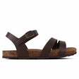 A brown microfiber sandal with leather lining and EVA sole, featuring an ankle strap and two parallel straps across the footbed.