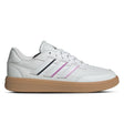 White sneaker with pink accents on a white background